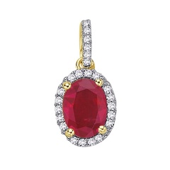 Staviori wisiorek. 24 diamenty, szlif brylantowy, masa 0,12 ct., barwa h, czystość si2. 1 rubin, masa 0,95 ct.. żółte złoto 0,585. wymiary 10x8 mm. długość 15 mm.