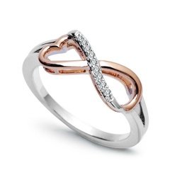 Staviori pierścionek. 9 diamentów, szlif brylantowy, masa 0,05 ct., barwa h, czystość si2. białe, różowe złoto 0,585. średnica korony ok. 7,2x16 mm. wysokość 3,7 mm.   